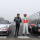Lewis Hamilton of England, driver of the Vodafone McLaren Mercedes MP4-23, poses for photographers alongside Tony Stewart, driver of the #14 Mobil 1/Office Depot Chevrolet, during the Mobil 1 Car Swap at Watkins Glen International on June 14, 2011 in Watkins Glen, New York.